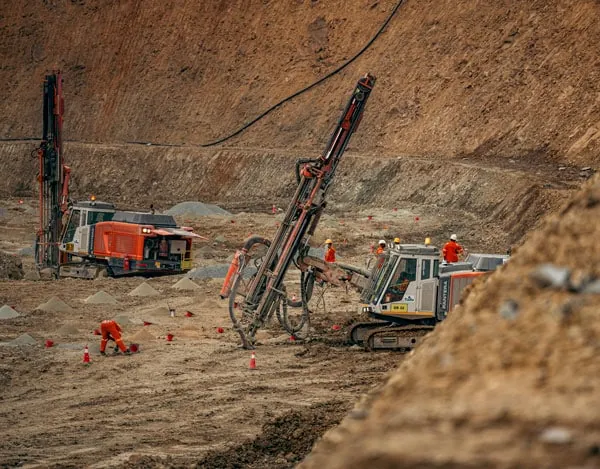 A drill rig on a blast pattern
