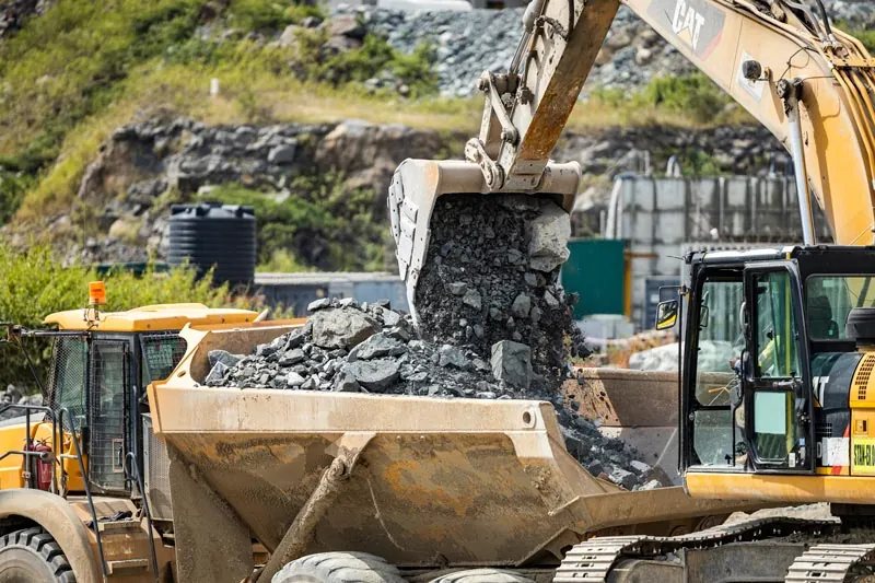 An excavator loading a dump truck at North Mara